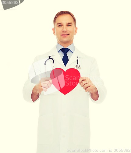 Image of smiling male doctor with red heart