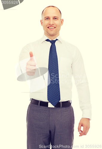 Image of smiling businessman showing thumbs up