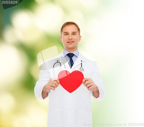 Image of smiling male doctor with red heart and stethoscope