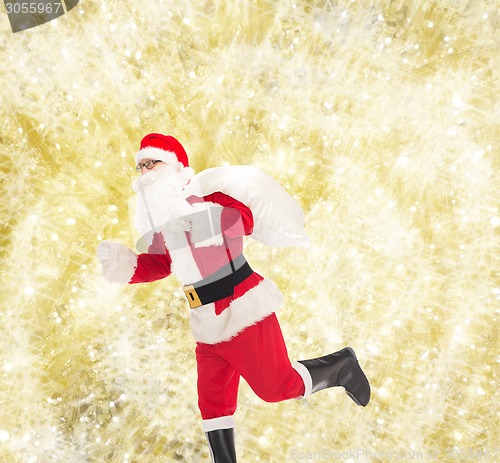 Image of man in costume of santa claus with bag