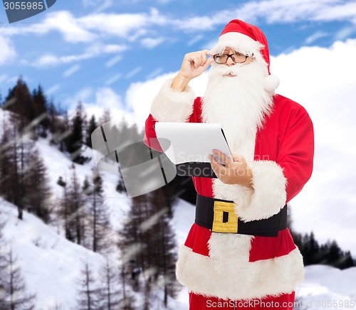 Image of man in costume of santa claus with notepad