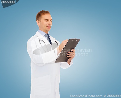 Image of smiling male doctor with clipboard and stethoscope