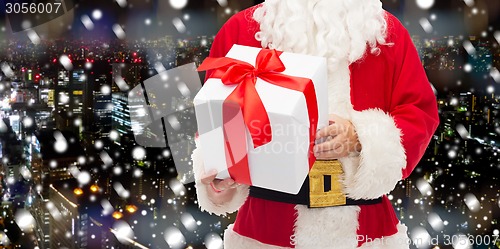 Image of man in costume of santa claus with gift box