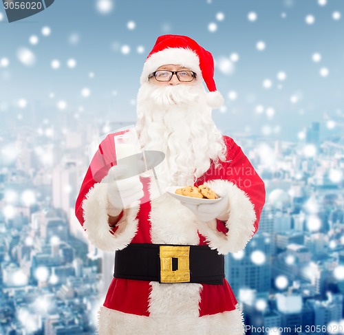 Image of santa claus with glass of milk and cookies