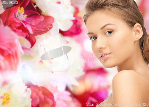 Image of beautiful young woman with bare shoulders