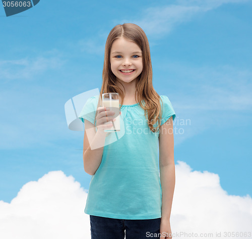 Image of smiling little girl with glass of milk