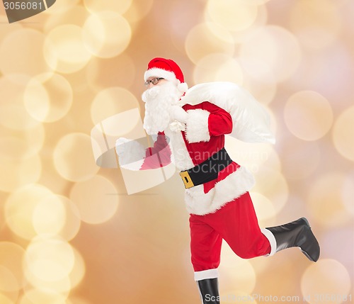 Image of man in costume of santa claus with bag