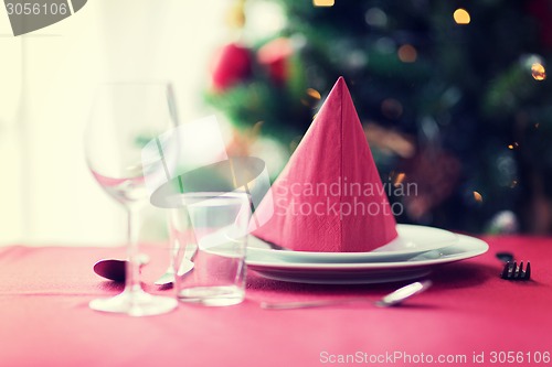 Image of room with christmas tree and decorated table