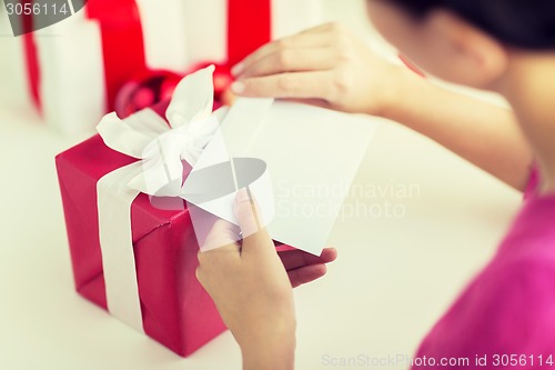 Image of close up of woman with letter and presents