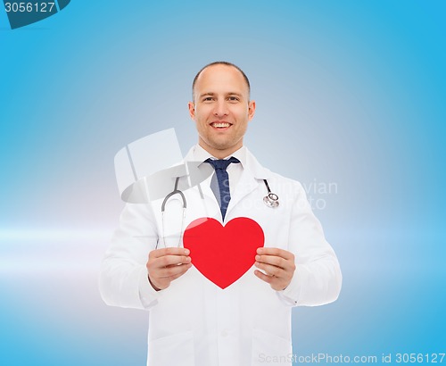 Image of smiling male doctor with red heart and stethoscope