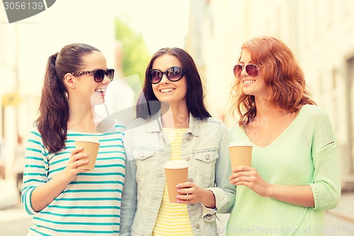 Image of smiling teenage girls with on street