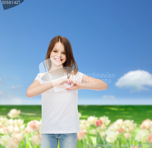 Image of smiling little girl in white blank t-shirt