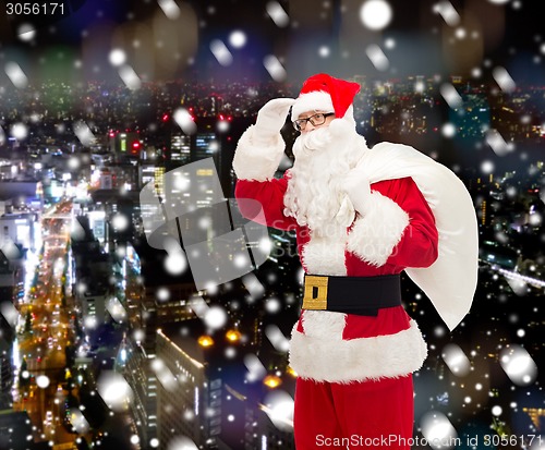 Image of man in costume of santa claus with bag