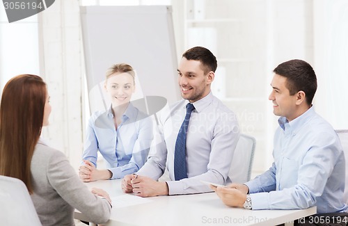 Image of business team interviewing applicant in office