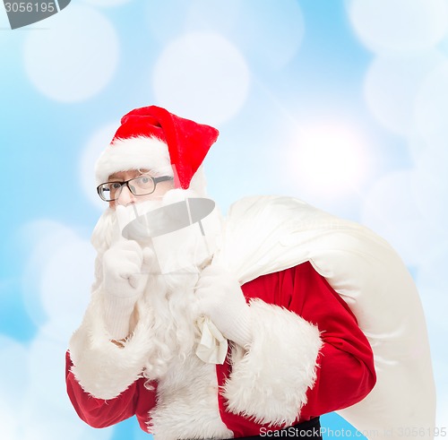 Image of man in costume of santa claus with bag