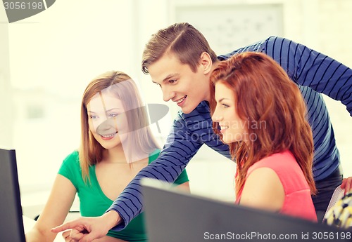 Image of group of smiling students having discussion