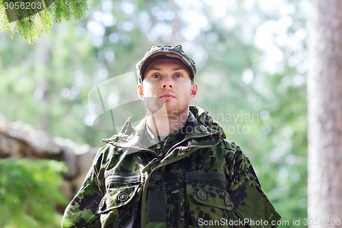 Image of young soldier or ranger in forest