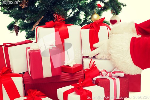Image of close up of santa claus with presents