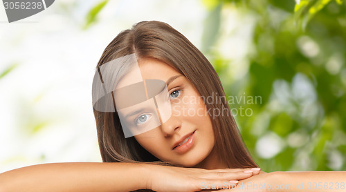 Image of beautiful young woman with bare shoulders