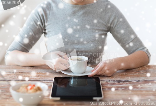 Image of woman pointing finger to tablet pc computer