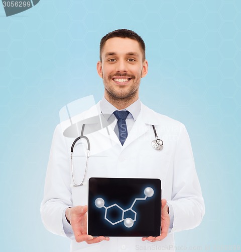 Image of smiling male doctor showing tablet pc screen