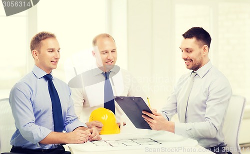 Image of happy team of architects and designers in office