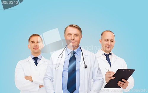 Image of group of smiling male doctors in white coats