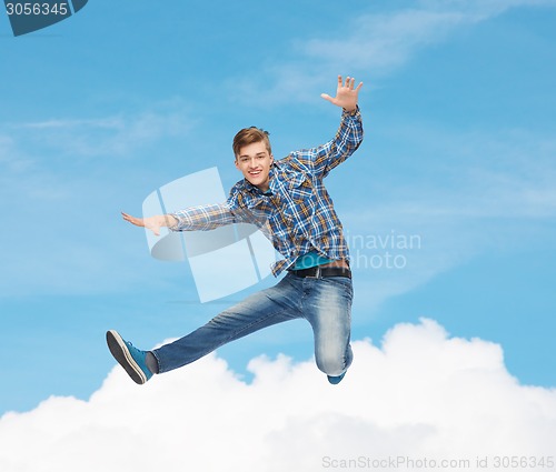 Image of smiling young man jumping in air