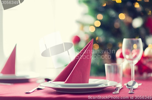 Image of room with christmas tree and decorated table