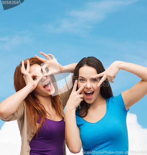 Image of smiling teenage girls having fun
