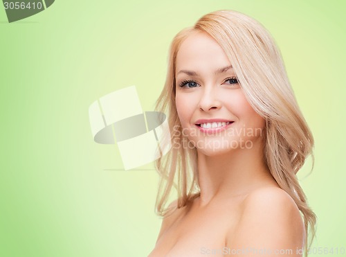 Image of beautiful young woman with bare shoulders