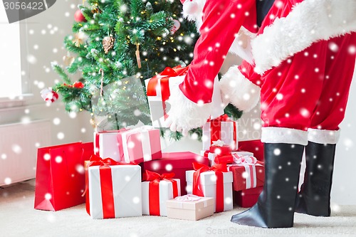 Image of close up of santa claus with presents