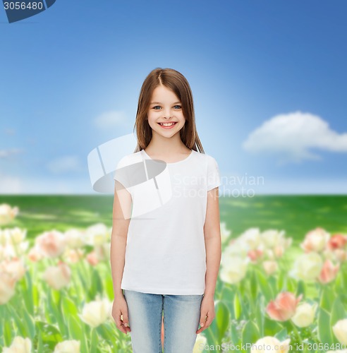 Image of smiling little girl in white blank t-shirt
