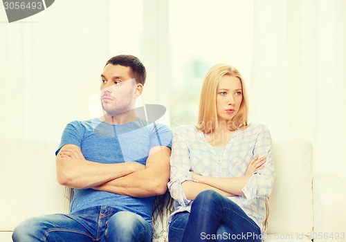 Image of unhappy couple having argument at home