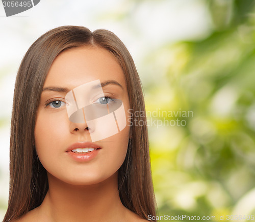 Image of beautiful young woman with bare shoulders