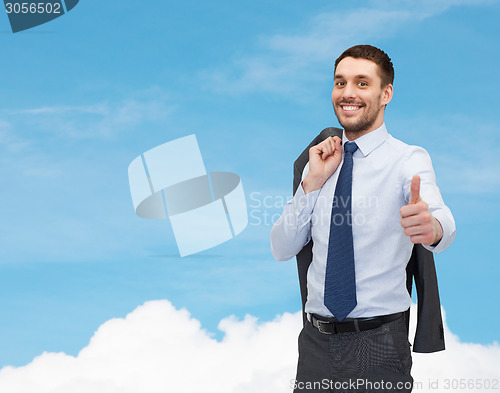 Image of smiling young businessman showing thumbs up