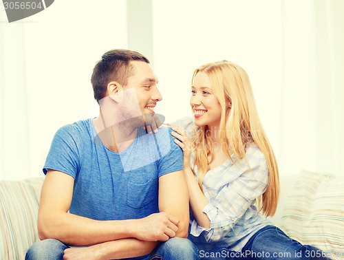 Image of smiling happy couple at home