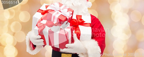 Image of close up of santa claus with gift box