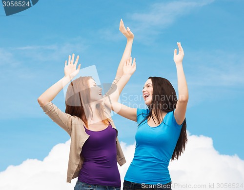 Image of smiling teenage girls having fun