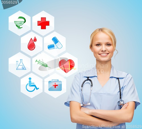 Image of smiling doctor over medical icons blue background