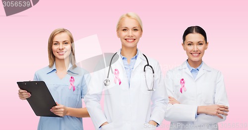 Image of female doctors with breast cancer awareness ribbon