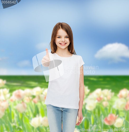 Image of smiling little girl in white blank t-shirt