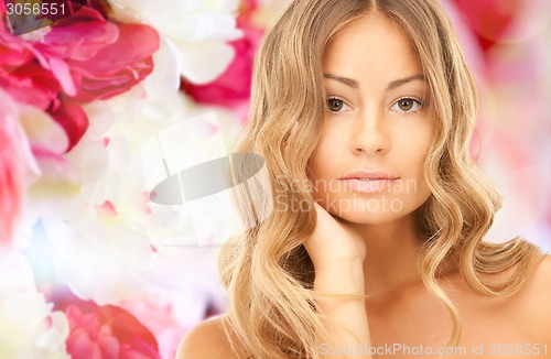 Image of beautiful young woman with bare shoulders