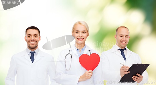 Image of group of smiling doctors with red heart shape