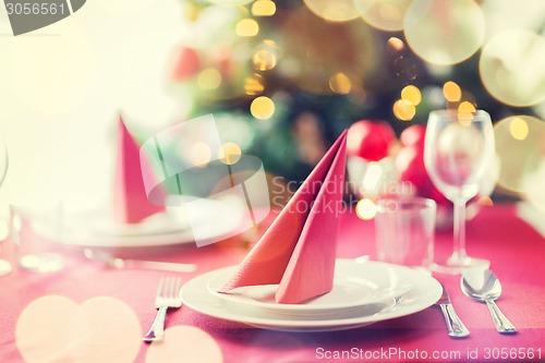 Image of room with christmas tree and decorated table