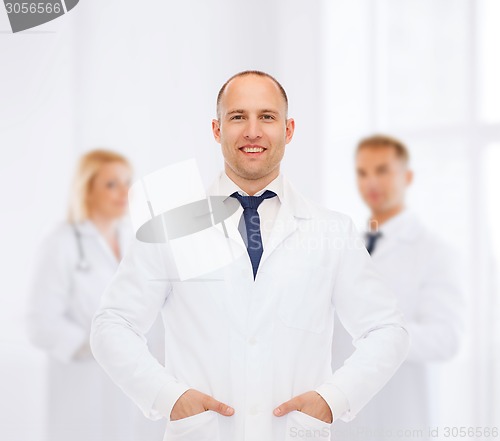 Image of smiling male doctor in white coat