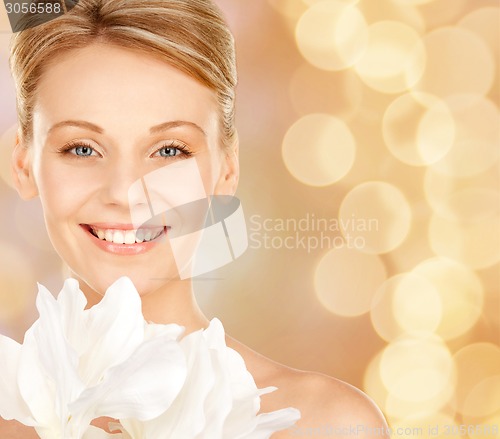 Image of beautiful young woman with bare shoulders