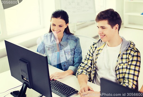 Image of two smiling students having discussion