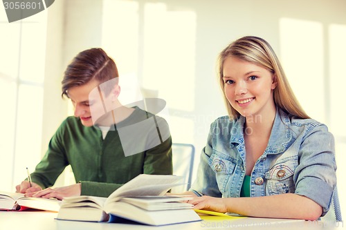 Image of students with textbooks and books at school