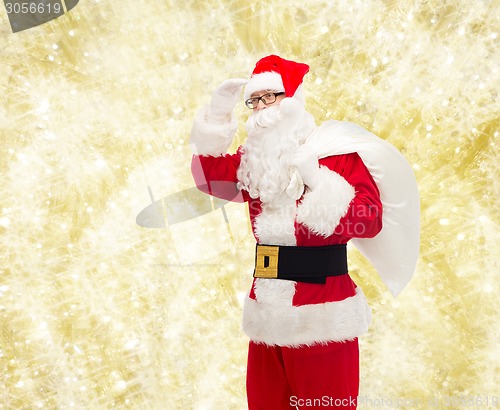 Image of man in costume of santa claus with bag